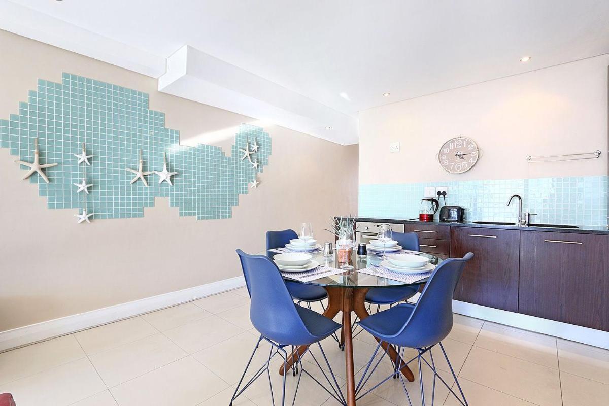 Eden On The Bay 118 By Hostagents Apartment Bloubergstrand Bagian luar foto