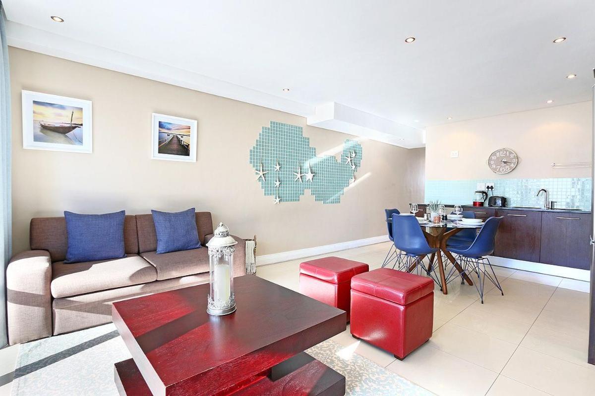 Eden On The Bay 118 By Hostagents Apartment Bloubergstrand Bagian luar foto