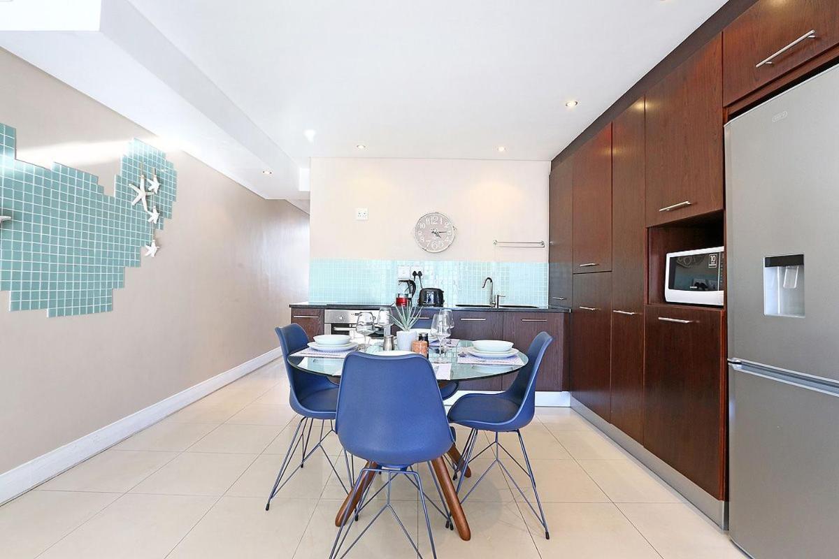 Eden On The Bay 118 By Hostagents Apartment Bloubergstrand Bagian luar foto