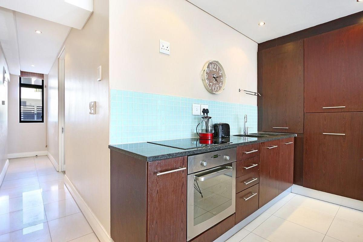 Eden On The Bay 118 By Hostagents Apartment Bloubergstrand Bagian luar foto